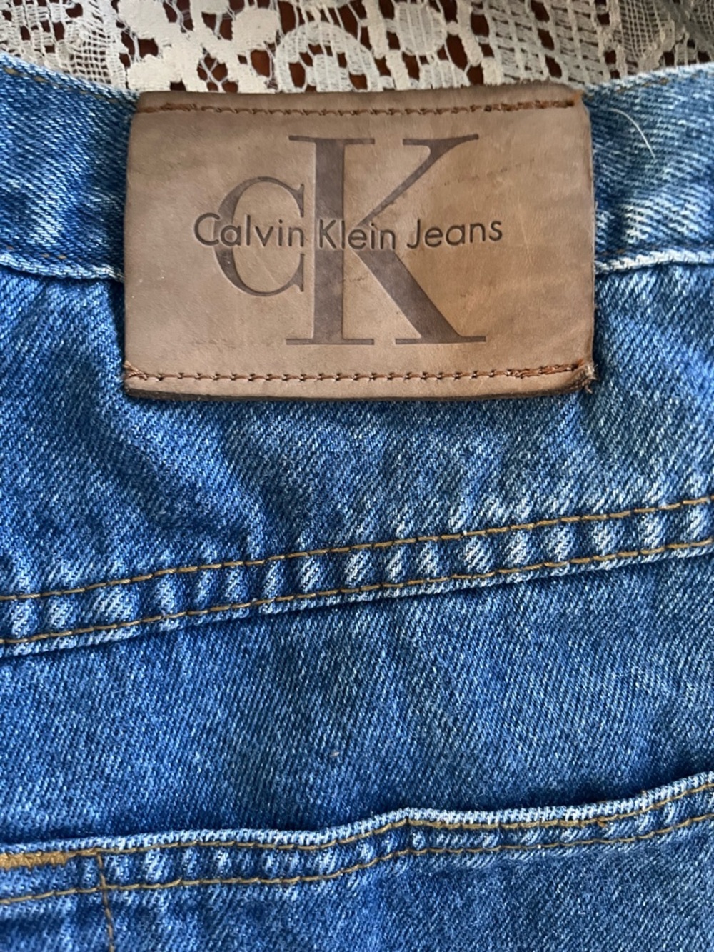 Calvin Klein Relaxed Fit Blue Denim Jeans with Brown Leather Patch